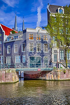 Travel Destinations. Romantic Amsterdam River Canal For Transportation and Boat Cruises For Guests and Visitors Along Arched