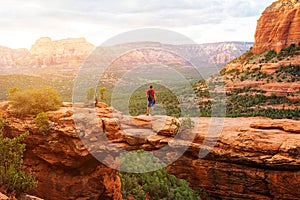 Travel in Devil`s Bridge Trail, man Hiker with backpack enjoying view, Sedona, Arizona, USA