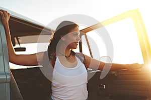 Travel does the mind good. an attractive young woman enjoying a road trip.