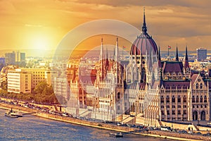 Travel and european tourism concept. Parliament and riverside in Budapest Hungary with sightseeing ships during summer day sunset.