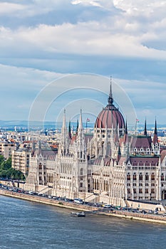 Travel and european tourism concept. Parliament and riverside in Budapest Hungary during summer sunny day with blue sky and clouds