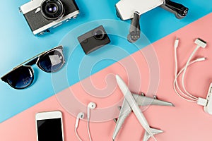 Travel Gadgets on blue and pink pastel