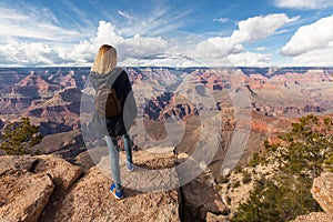 Travel in Grand Canyon, woman hiker with backpack enjoying view, USA