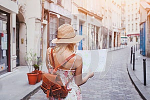 Travel guide, tourism in Europe, woman tourist with map