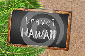 Travel Hawaii palm trees and blackboard on sandy beach