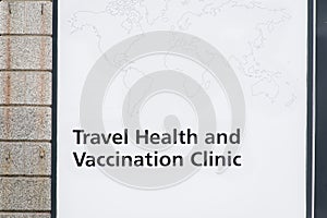 Travel health and vaccination clinic sign on chemist window