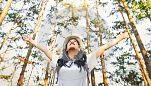 travel hiker walking in natural forest happy with arm up