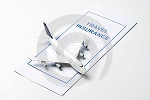 Travel insurance brochure with airplane model