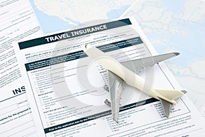 Travel insurance form and plane model