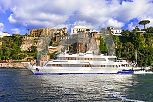 Travel in Italy  - ferry boat in Sorrento coastal town, Naples bay photo