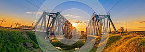 Travel landscape. Two railway bridges at dawn.