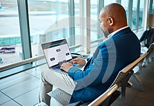 Travel, laptop and serious with black man in airport for planning, vip lounge and communication. Relax, internet and