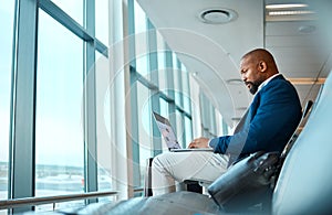 Travel, laptop and website with black man in airport for online booking, vip lounge and communication. Relax, internet