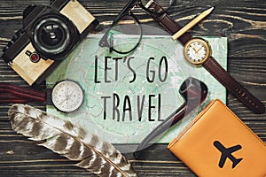 Travel. let`s go travel text sign concept on map. wanderlust hip