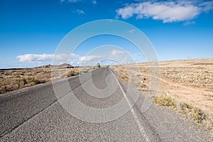 Travel on a long road in Fuerteventura with desert at both sides
