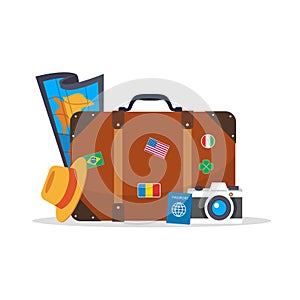Travel luggage with passport, camera and map isolated on white background.