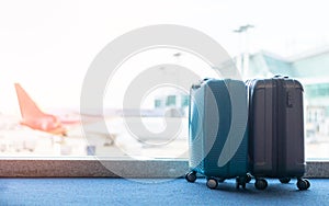 Travel luggage suitcase at the airport terminal in waiting area departure flight for business transportation security traveller