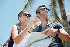 Travel, map and couple on vacation together for adventure, holiday and sightseeing in outdoor for summer. Tourist