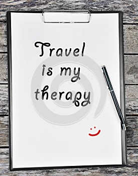 Travel is my therapy written on paper