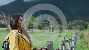 Travel, nature and mockup with an indian woman walking alone in a field for sightseeing or to relax. Earth, mountain and