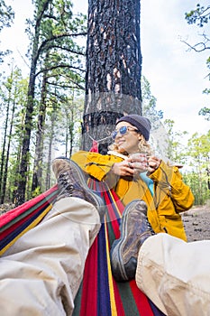 Travel in the nature people concept lifestyle - beautiful portrait of young adult woman viewed from legs point of view of man