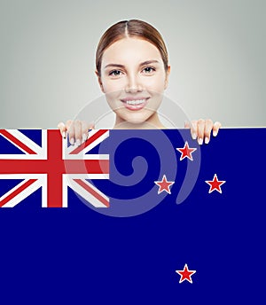 Travel in New Zealand. Happy girl student with New Zealand flag