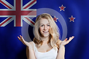 Travel in New Zealand. Surprised Happy girl student with New Zealand flag