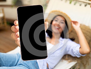 Travel Offer. Blank Smartphone In Hand Of Asian Woman Lying In Hammock