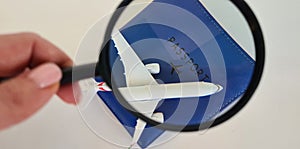 Travel passenger plane with passport and magnifiers