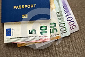 Travel passport and money, Euro banknotes bills on copy space background, top view. Traveling and  finance problems concept