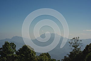 travel and people activity with twilight sky before sunrise with mountain and fog on foreground