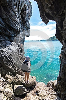 Travel people women tourist in a cave near the sea in Keo Sichang,