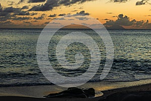 Travel photo of St. Barthâ€™s Island St. Bartâ€™s Island, Caribbean. View of a peaceful sunset and waves on Shell Beach