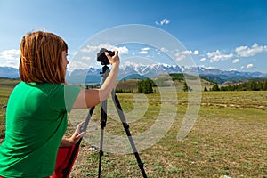 Travel photographer taking nature photo