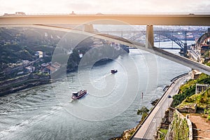 Travel Places Ideas. Lines of Boats and Porto Cityscape at Daytime with Ponte Infante D Henrique in Background in Portugal