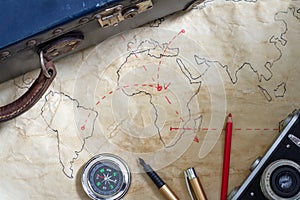 Travel plan abstract concept with old maps suitcase and camera