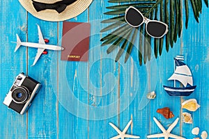 Travel Plan. Traveler planning trips summer vacations on the beach with Traveler`s accessories, retro camera, sunblock, sunglasse