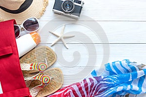 Travel Plan. Traveler planning trips summer vacations on the beach with Traveler`s accessories, retro camera,