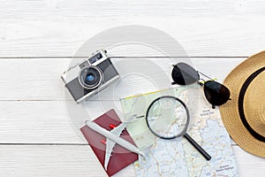 Travel Plan. Traveler planning trips summer vacations with Traveler`s accessories, retro camera, sun glass and passport in summer