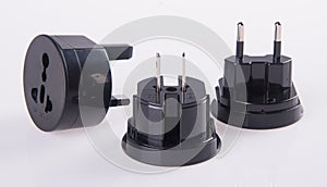 Travel plug adapter on a background