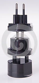 Travel plug adapter on a background
