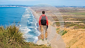 Travel in Point Reyes National Seashore, man Hiker with backpack enjoying view, California, USA