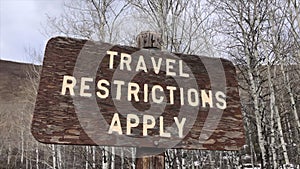 Travel Restrictions Apply Sign Outdoors