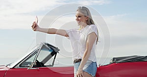 Travel, selfie and woman in a car for road trip, vacation or weekend holiday in the coast. Transport, adventure and