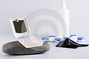 Travel set for storing contact lenses on a case for glasses. Alternative for vision correction