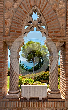 Travel sightseeing in Spain looking through castle window