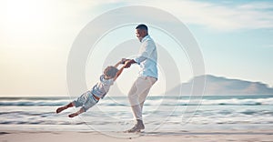 Travel, spinning and father with son at beach for bonding, support and summer break. Happy, playing and vacation with