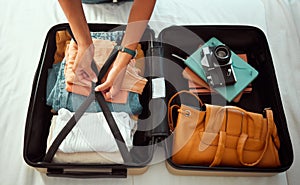 Travel suitcase, bedroom and hands of woman packing for Europe holiday, vacation or adventure tourist journey