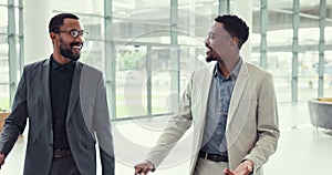 Travel, suitcase and business men walking in an airport together for an international flight while talking. Corporate