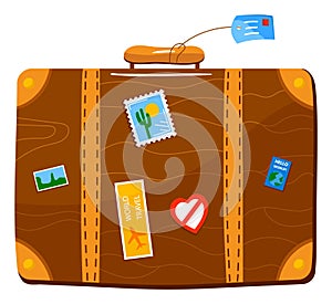 Travel suitcase covered in colorful stickers, signaling a seasoned explorer. Vacation luggage indicating global
